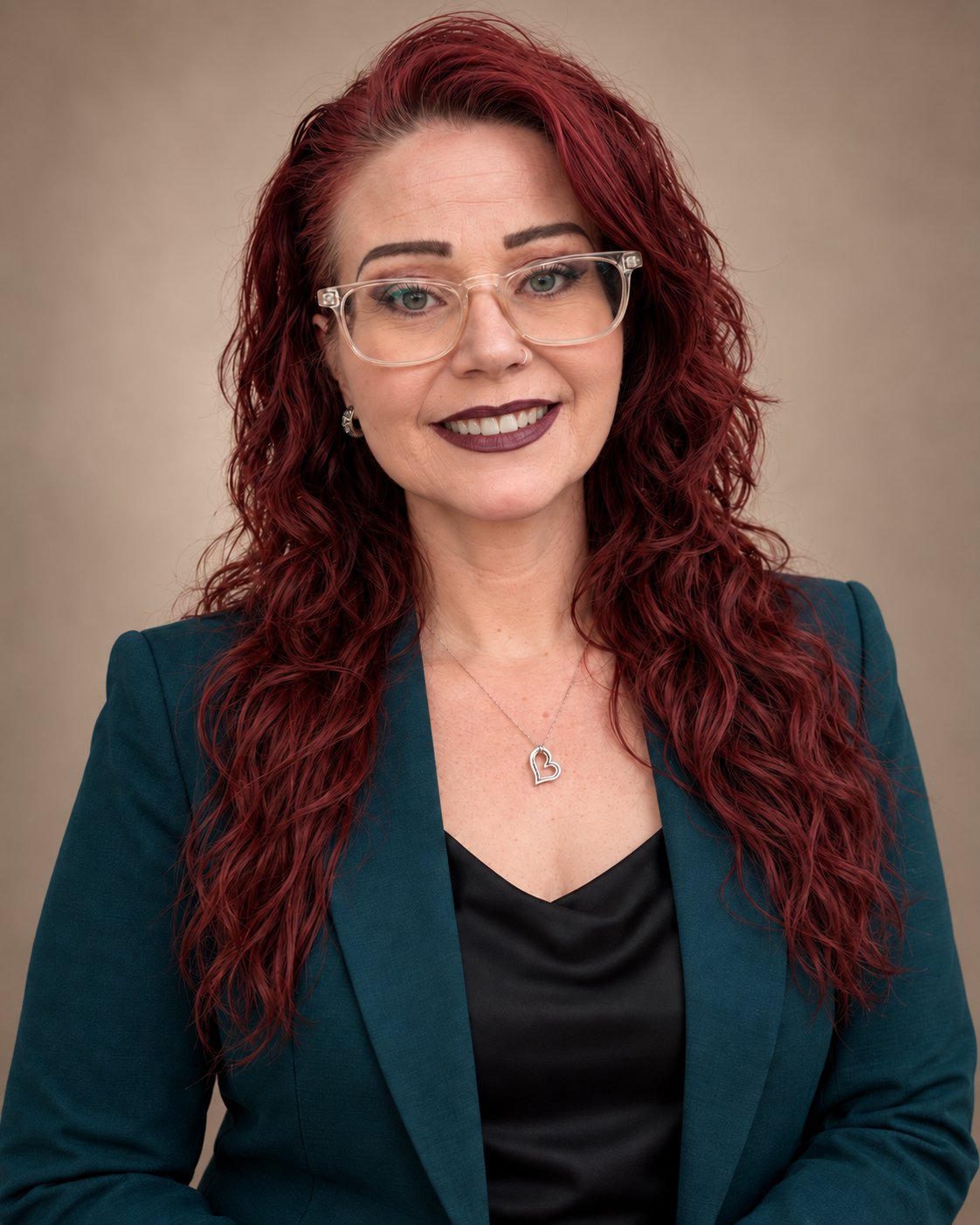 Caroline Swan, U.S. Army veteran and author, in a teal blazer